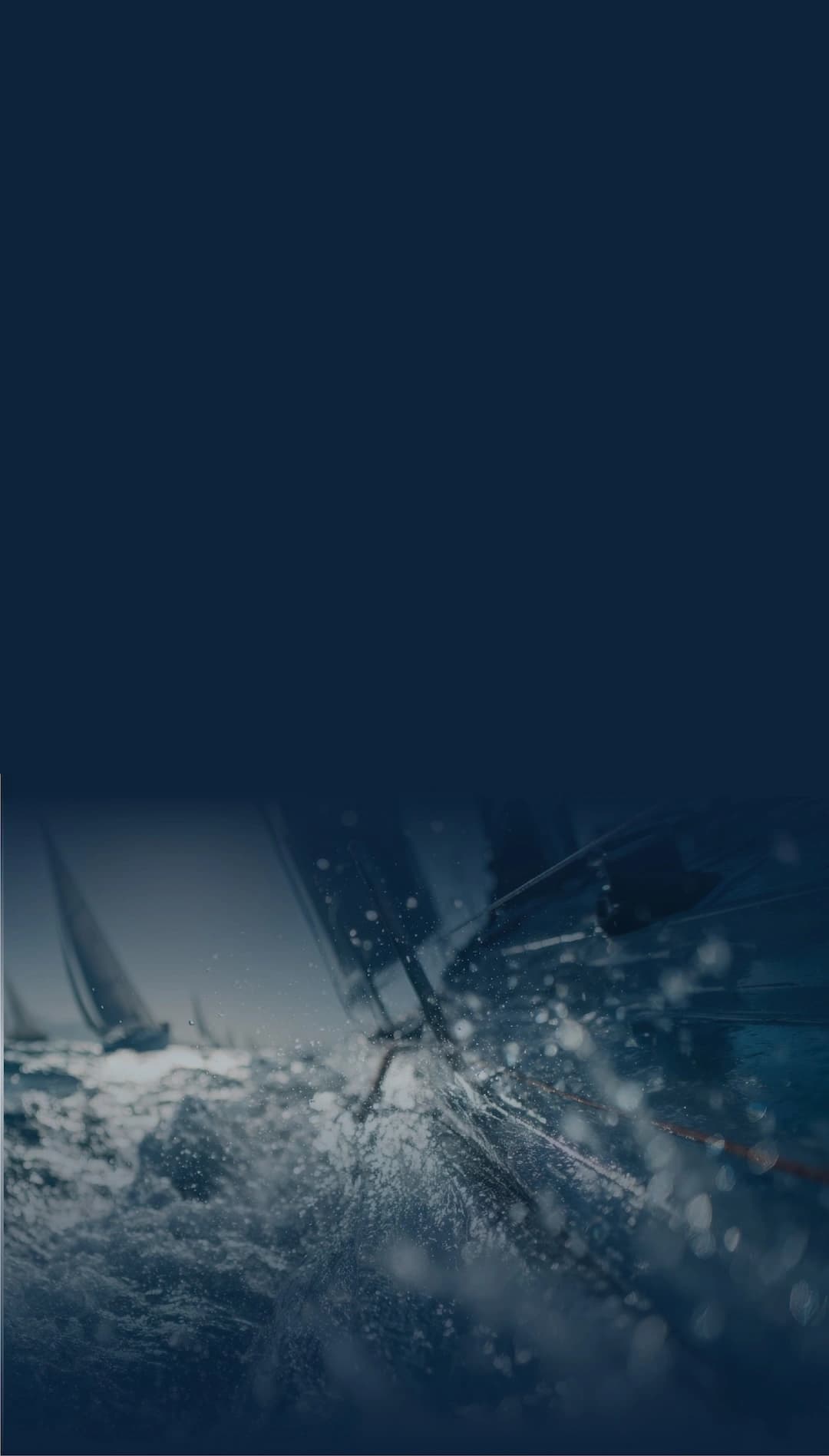 Close-up of sailboat rigging hardware and lines under load in wet sailing conditions
